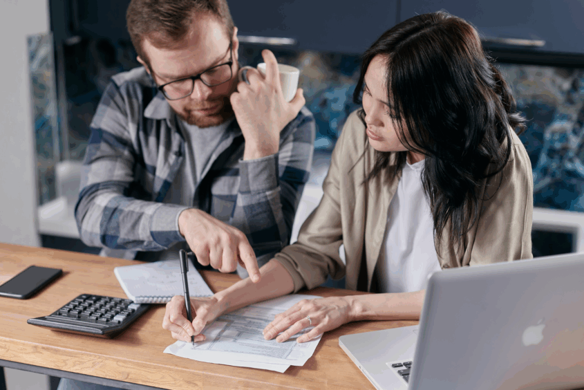 People looking at bills