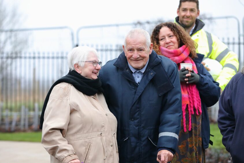 two elderly residents stood smiling