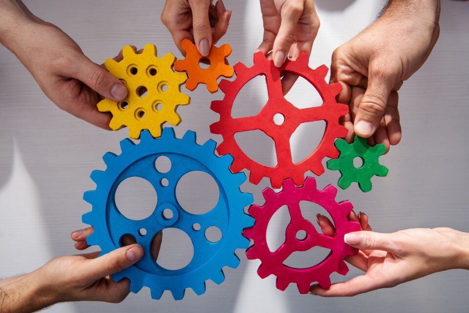 Multiple cogs joined together demonstrating partnerships