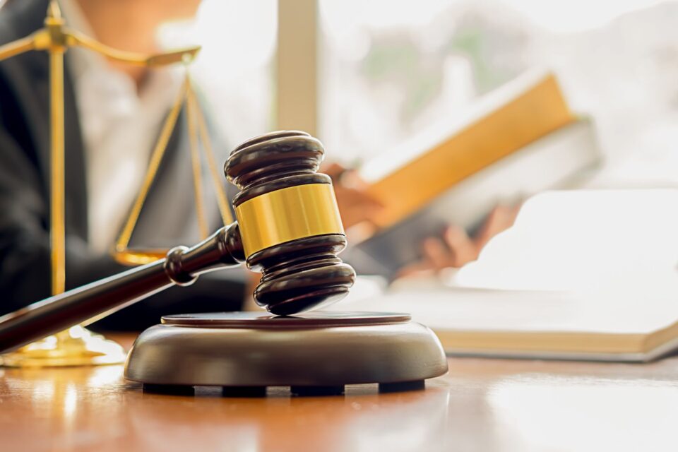 Picture of a judge's gavel resting on the stand