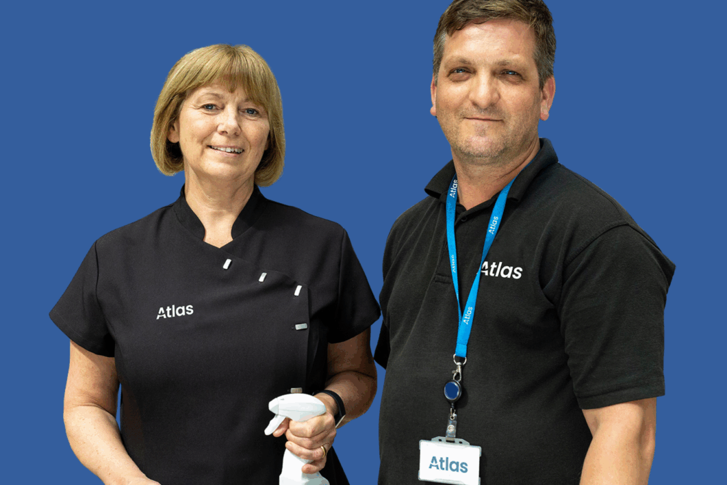 Two people wearing Atlas FM uniform smiling at the camera