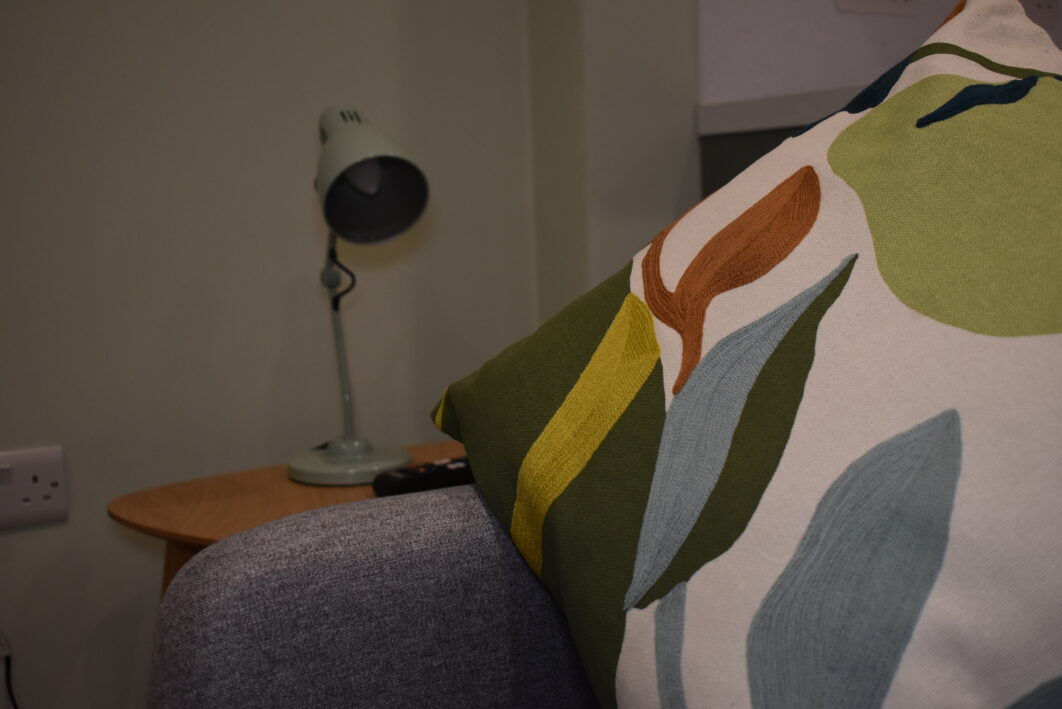 Sofa with a colourful patterned cushion