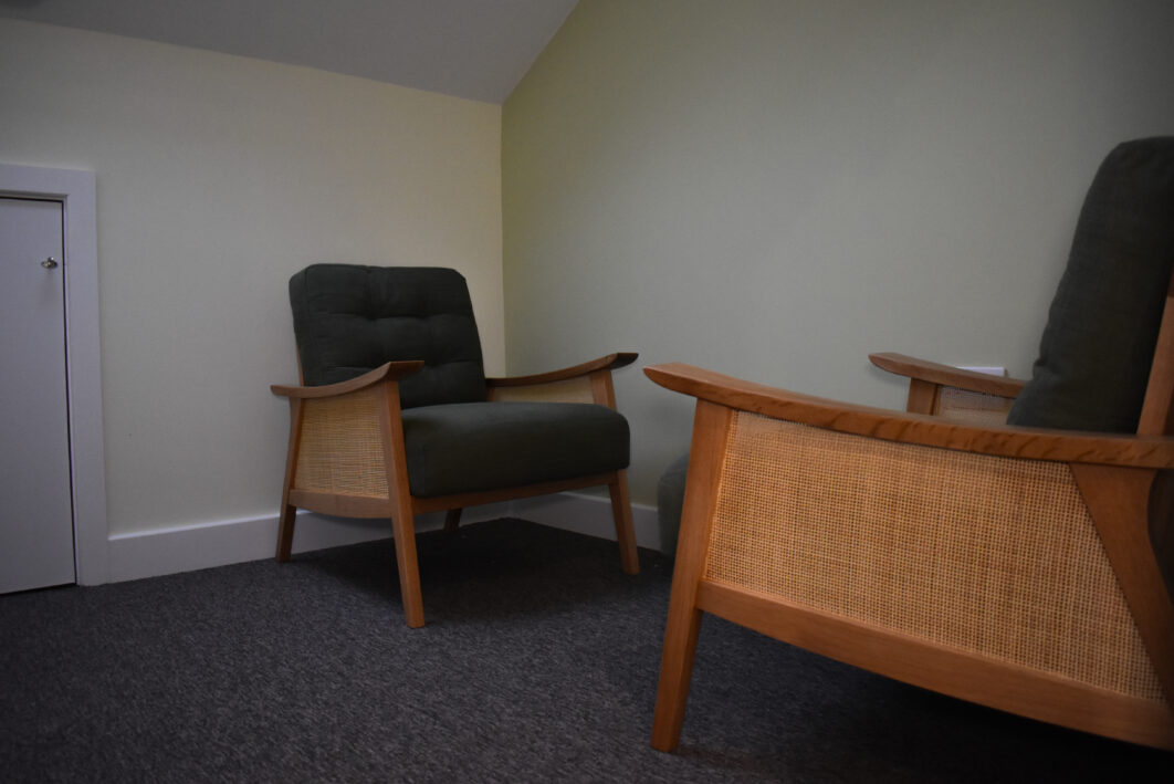 A room with two chairs facing each other