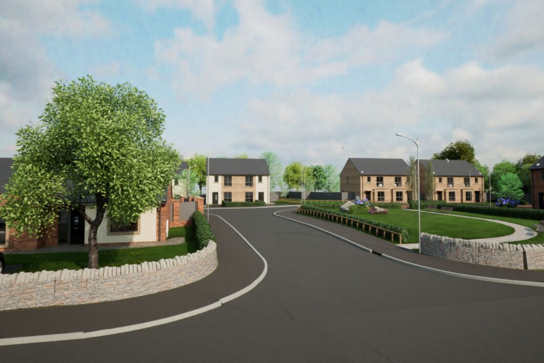 Entrance to new build development. Road with Houses in the background