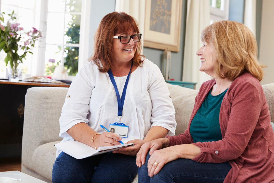 Two women talking on the sofa