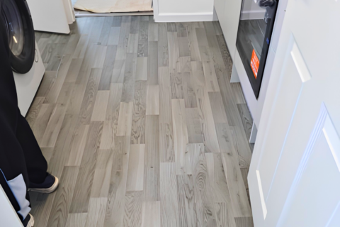 Close up of grey wood effect lino