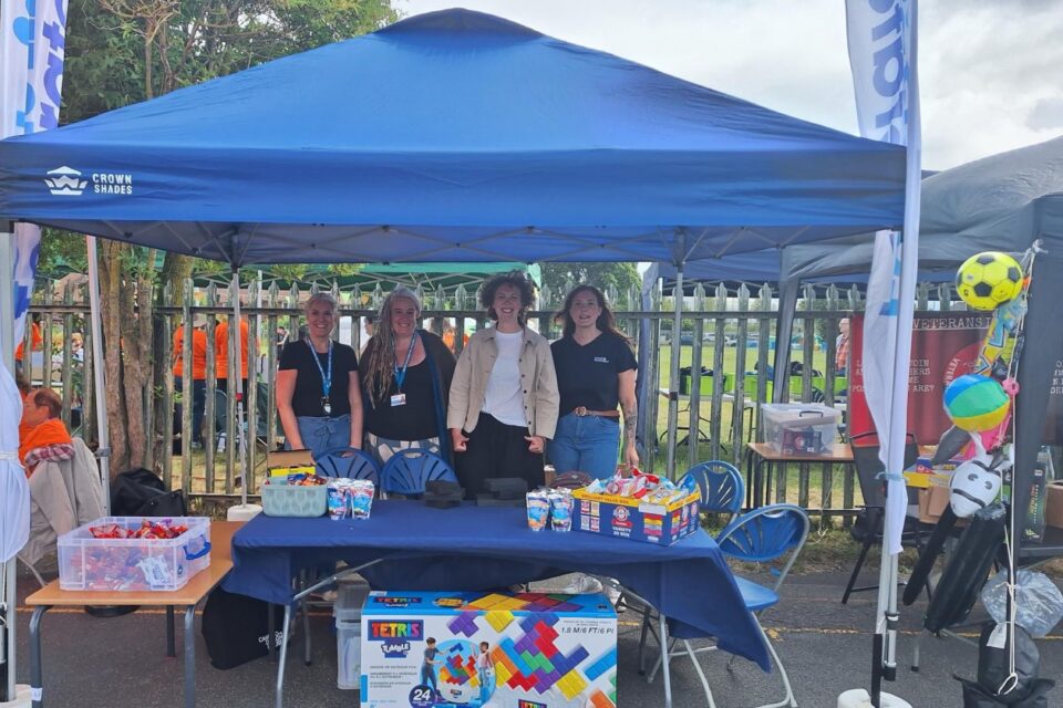 4 colleagues standing under a gazebo