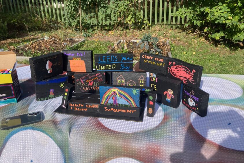 painted boxes with writing on